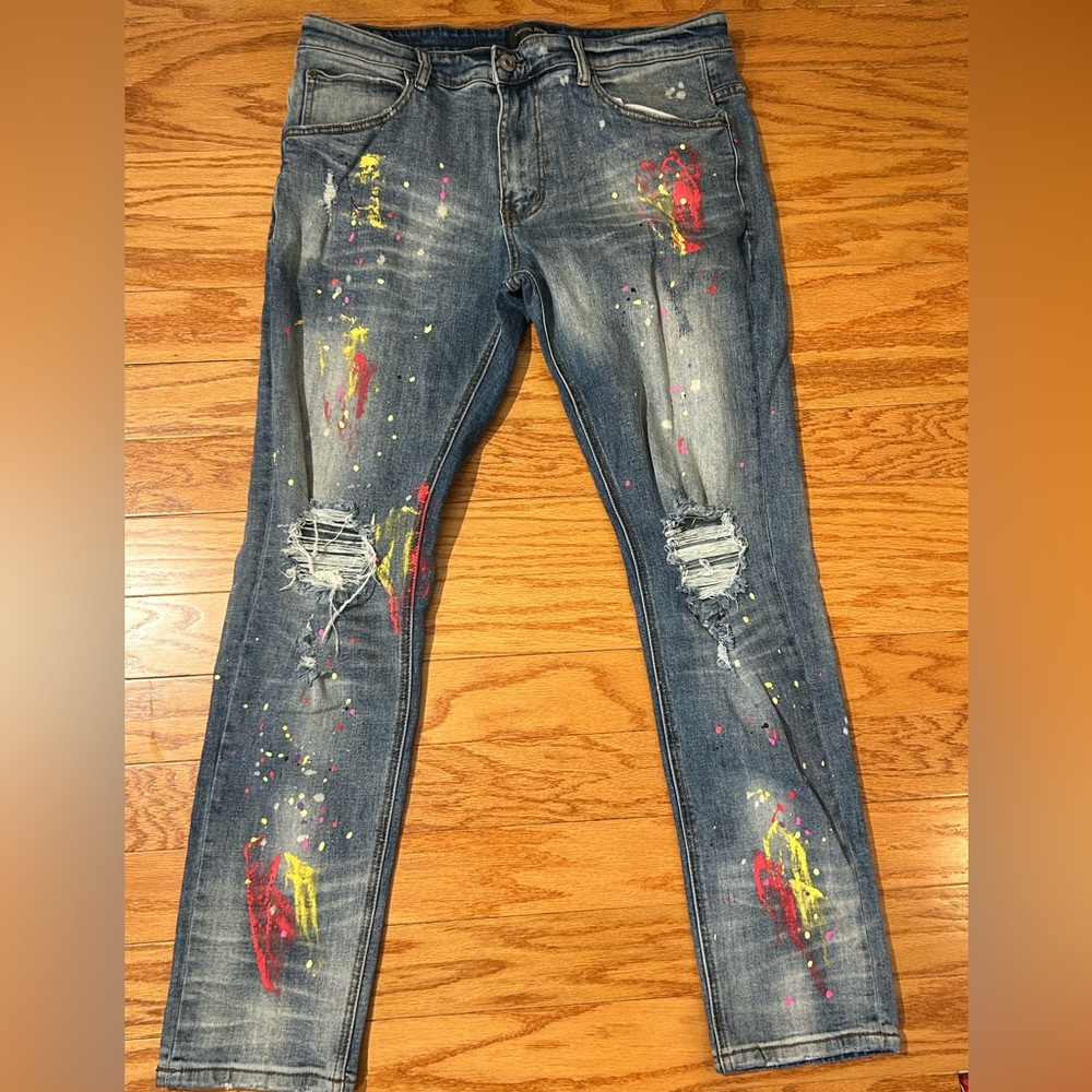 Stylish Distressed Blue Jeans with Colorful Accents
